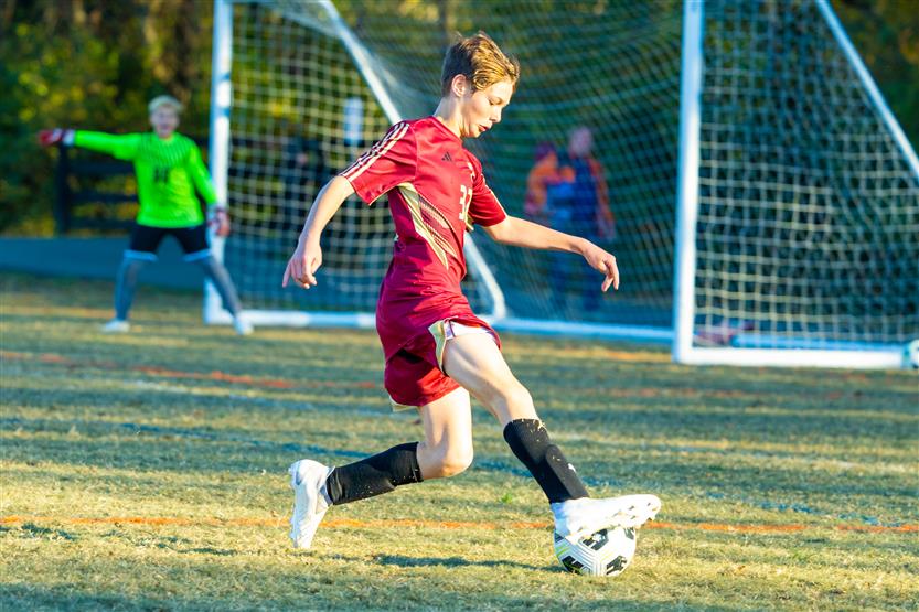 Middle school students play soccer